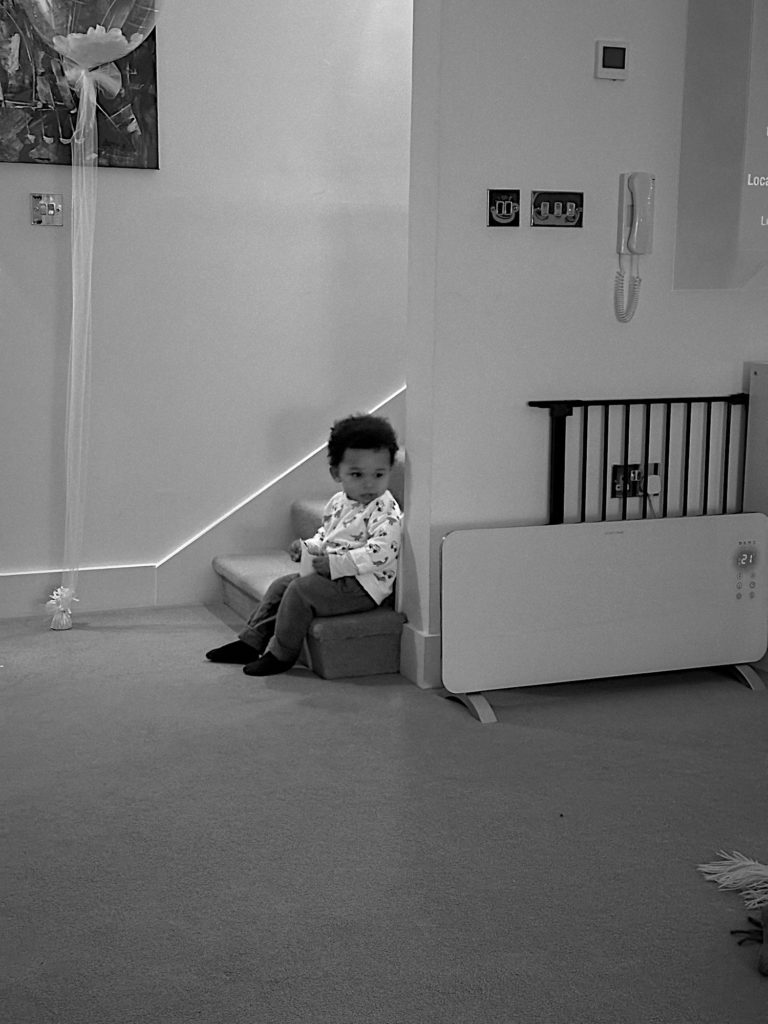 Sitting on the stairs eating cheese