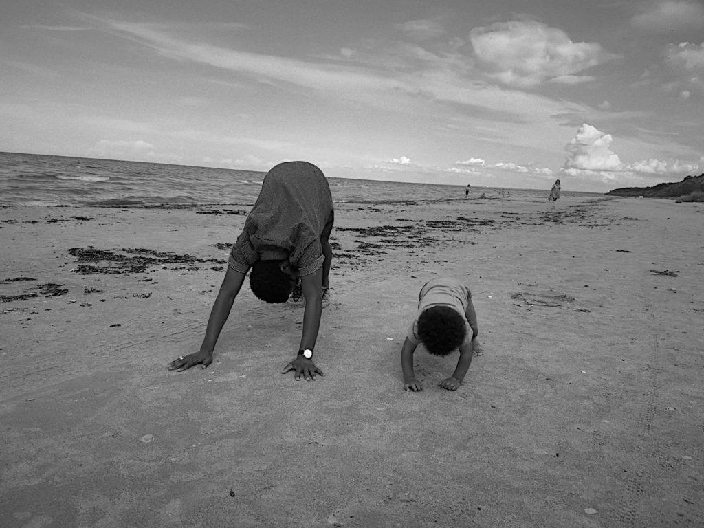 Down dog on the beach